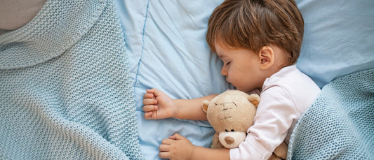 toddler sleeping in twin bed