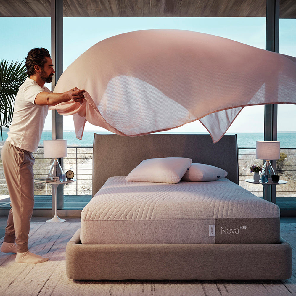 Casper Nova Hybrid Snow Mattress On Bed In Bedroom Man Covering Mattress With Sheet