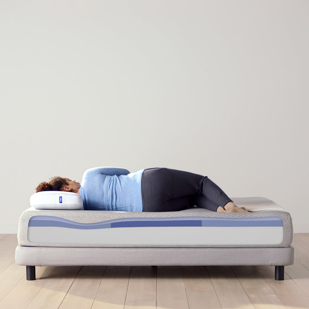 Woman Sleeping On Casper Original Foam Mattress On Bed In Bedroom, With Mattress Showing Foam Layer Cutaway