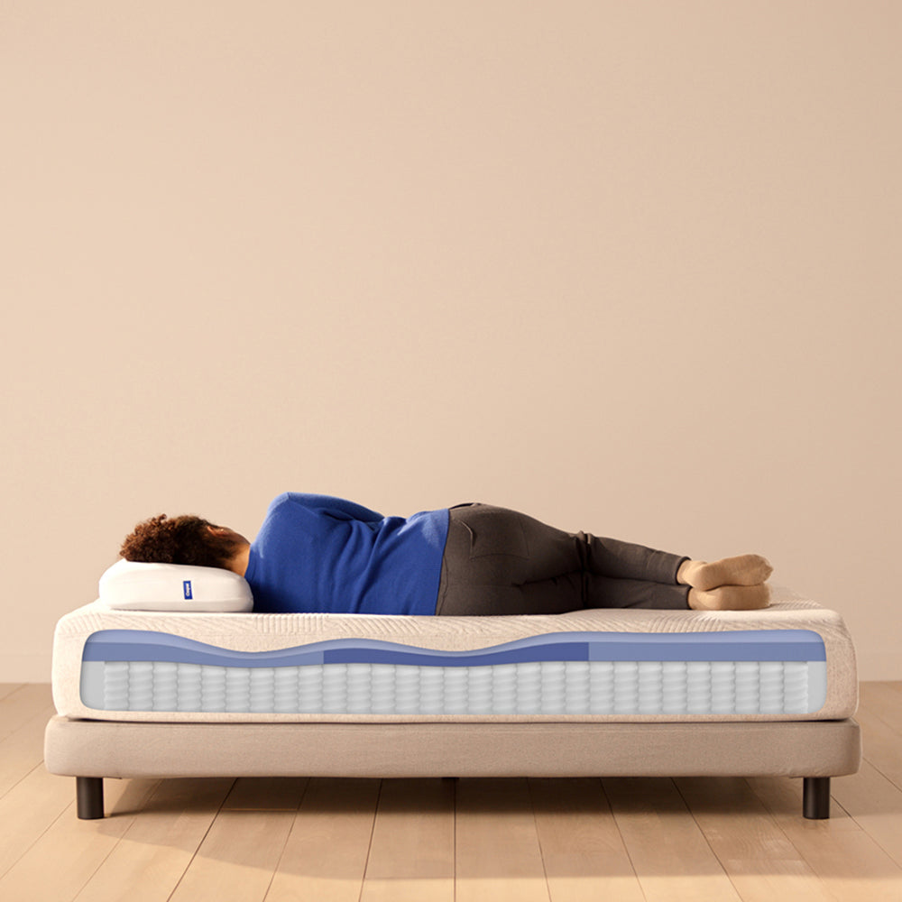 Woman Sleeping On Casper Original Hybrid Mattress On Bed In Bedroom, Mattress Showing Foam Layer Cutaway