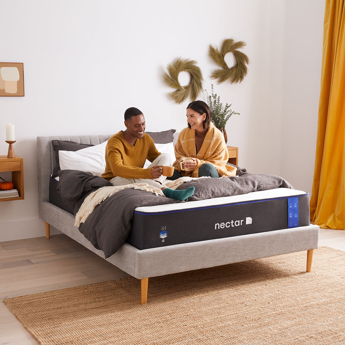 Couple Relaxing On Nectar Classic 4.0 Mattress
