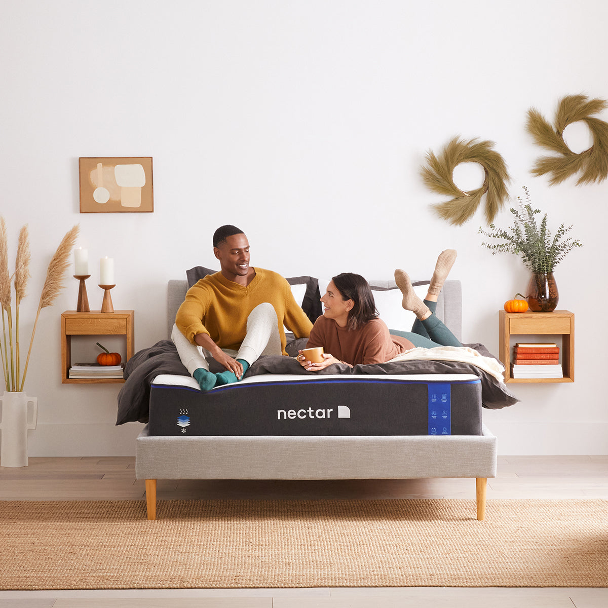 Couple Relaxing On Nectar Classic 4.0 Mattress