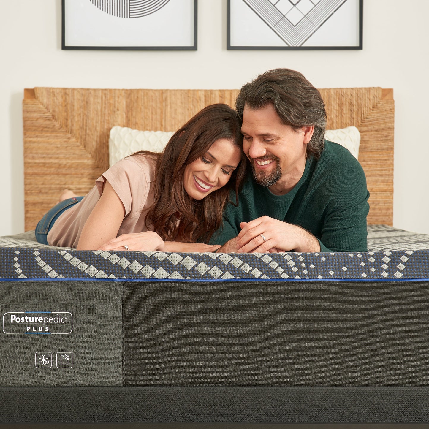 Couple Relaxing On A Sealy Albany Soft Mattress In Bedroom