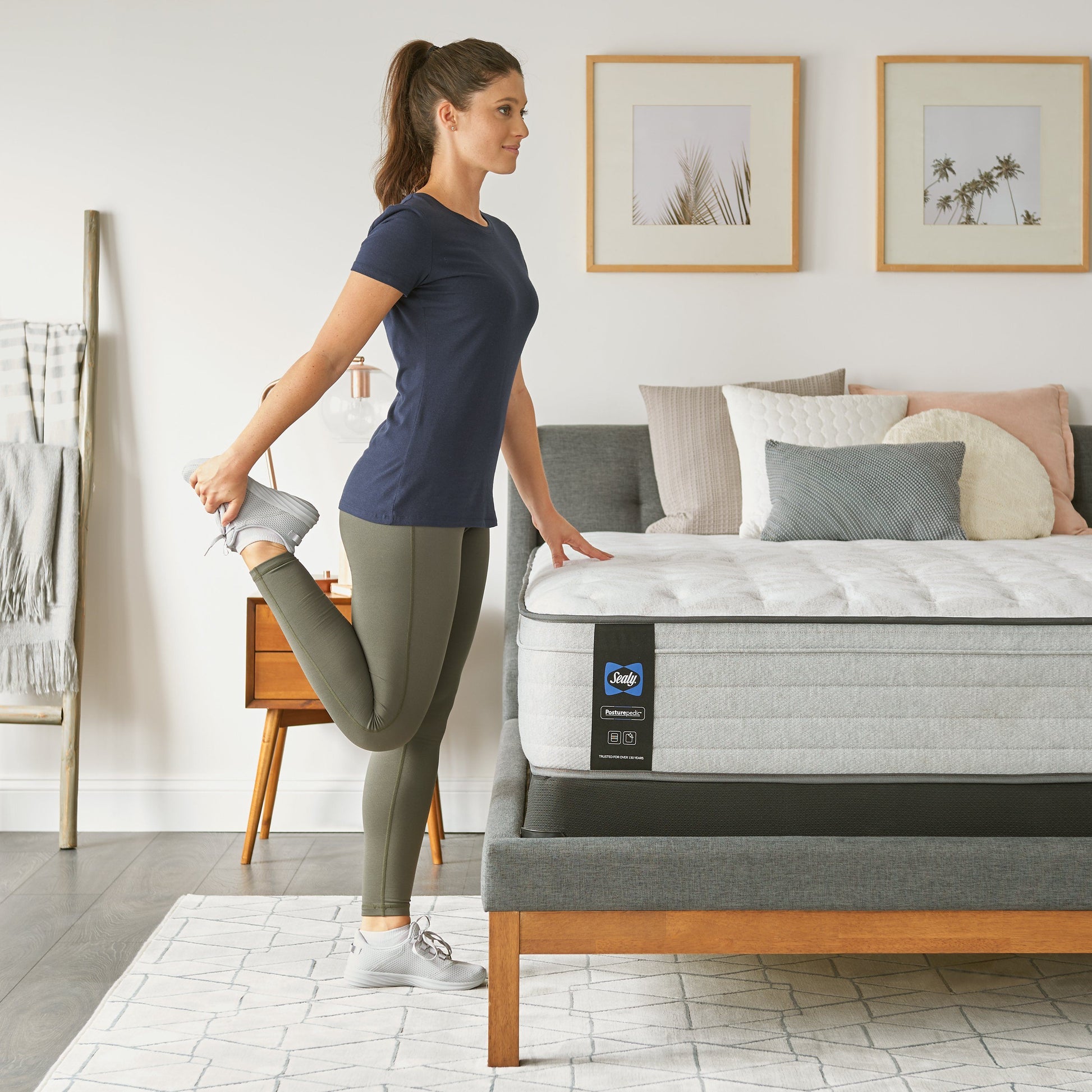 Sealy Idlewild Firm Mattress In Bedroom Woman Stretching