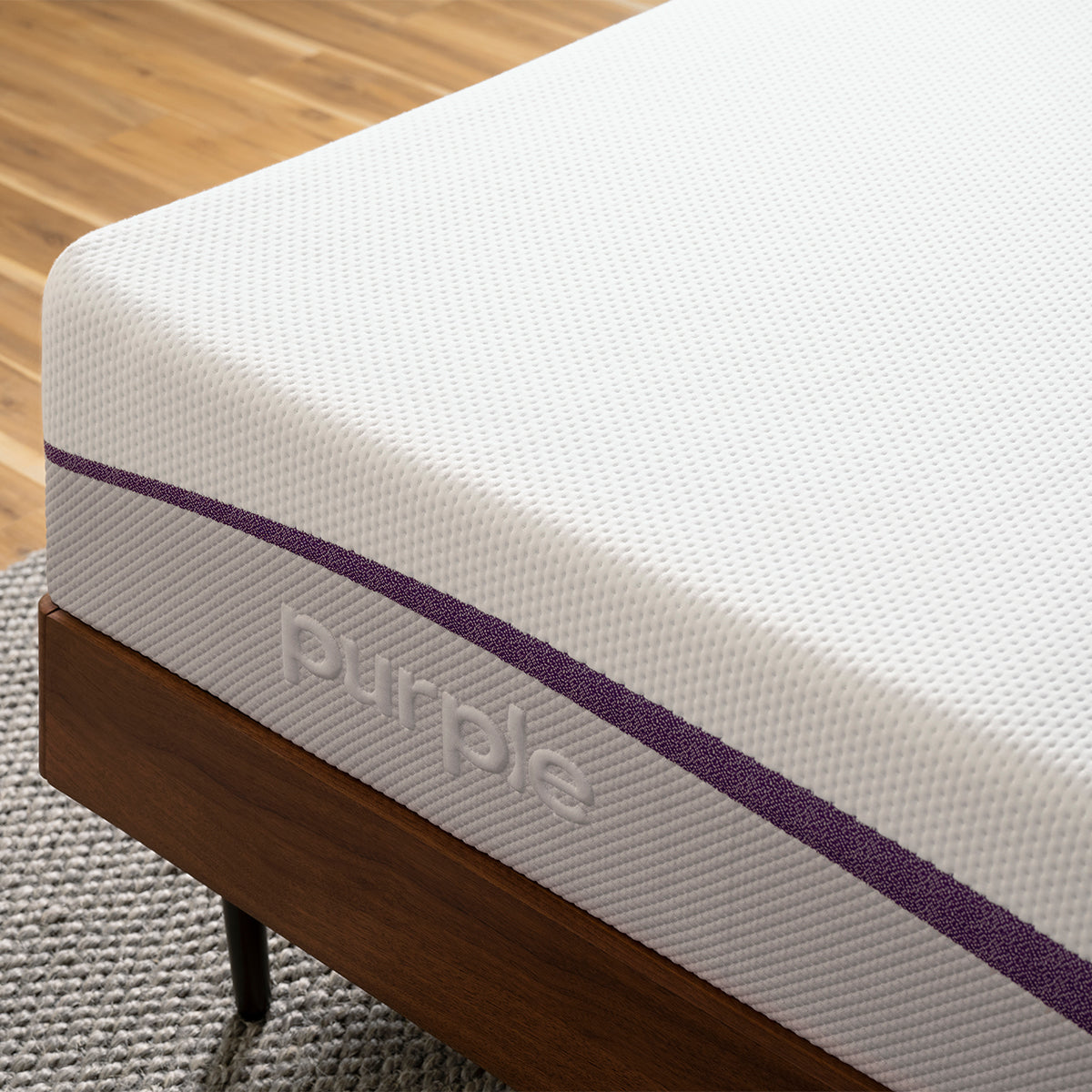 Purple Mattress Corner Detail In Bedroom