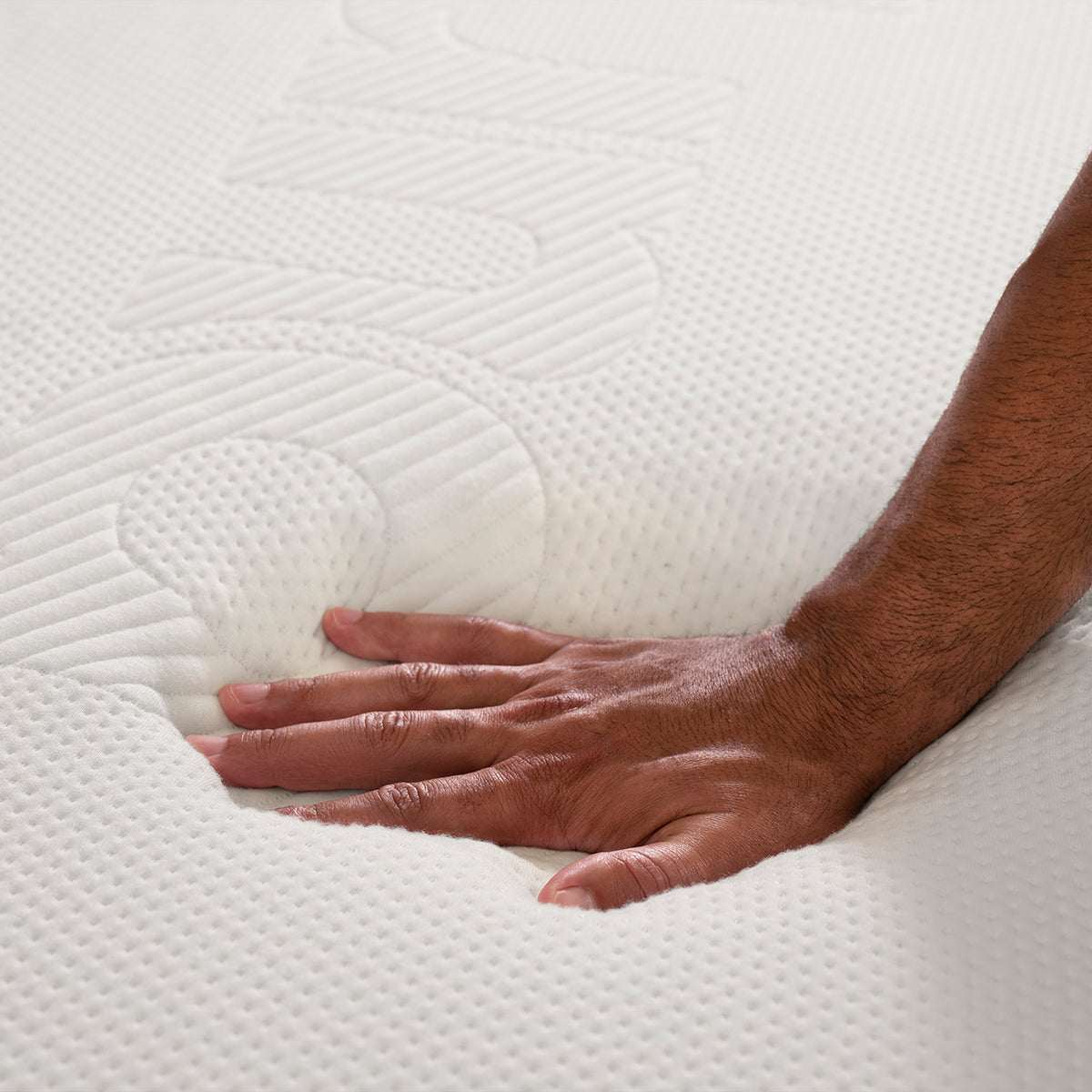 Purple Mattress with Hand Pushing On Mattress
