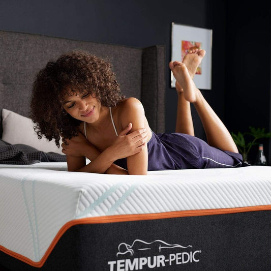 TEMPUR-ProAdapt Firm Mattress Room Shot with Woman Relaxing