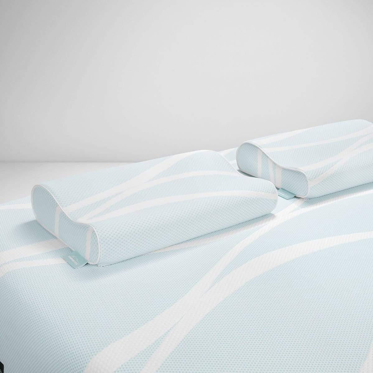 TEMPUR-Breeze Cooling Neck Pillows by TEMPUR-Pedic on a mattress