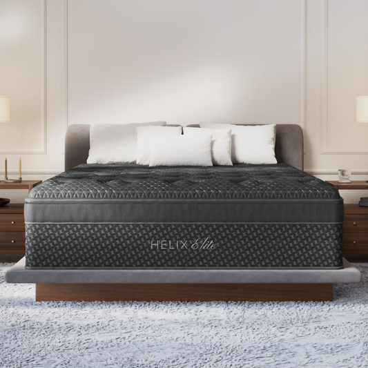 Helix Midnight Elite memory foam mattress on a low wood platform bed in a bedroom