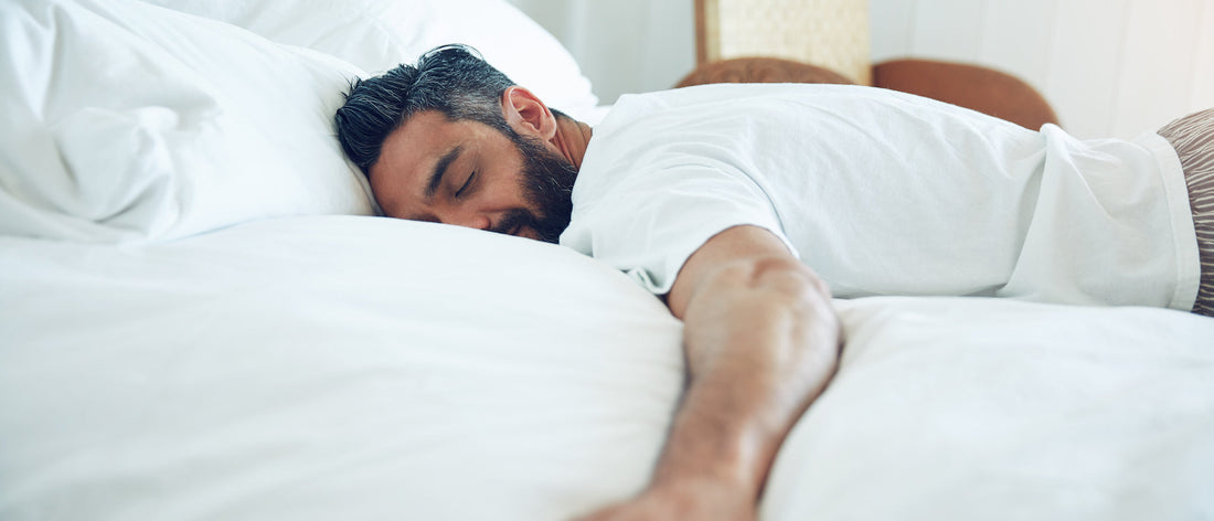 Why is REM sleep important? Man sleeping in bed.