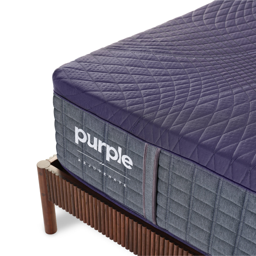 Corner shot image of a Purple Rejuvenate mattress.