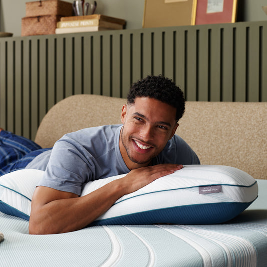 Model Leaning on TemperPedic Adapt ProHi Adjust Pillow