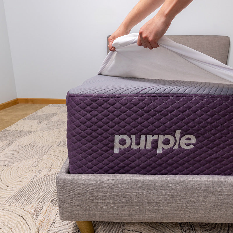 Purple Waterproof Mattress Protector bed corner image.