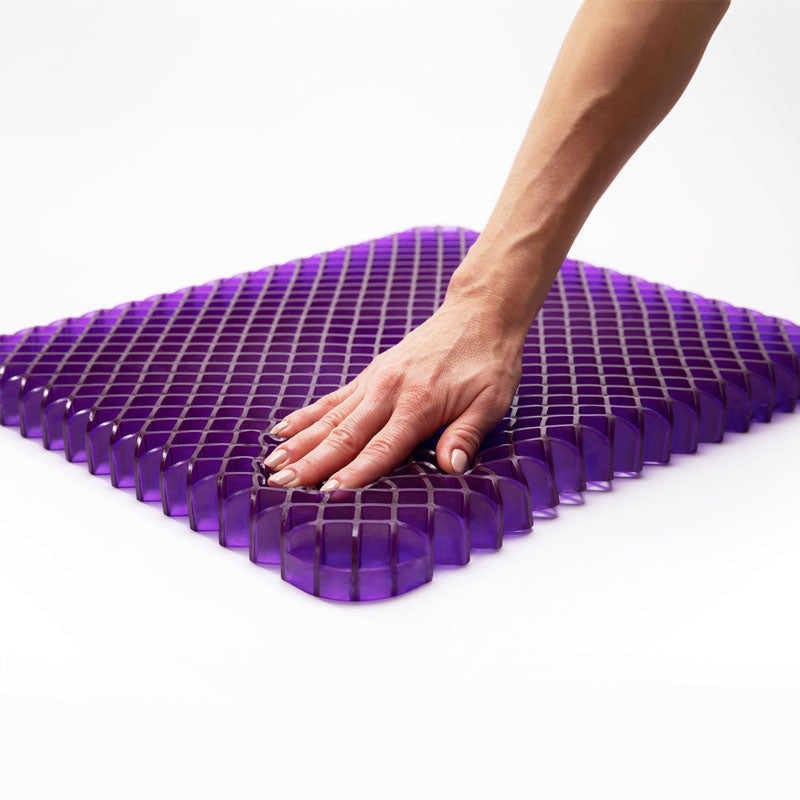 Purple Simply Seat Cushion construction grid with hand.