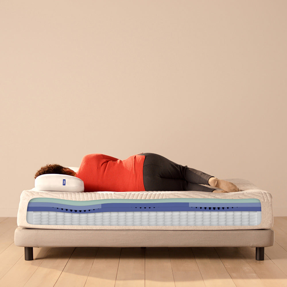 Woman Sleeping On Casper Nova Hybrid Mattress On Bed In Bedroom, With Mattress Foam Layer Cutaway