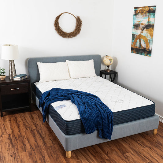 Cheswick Manor Northridge Mattress On Bed Frame In Bedroom With Pillows and Blue Blanket