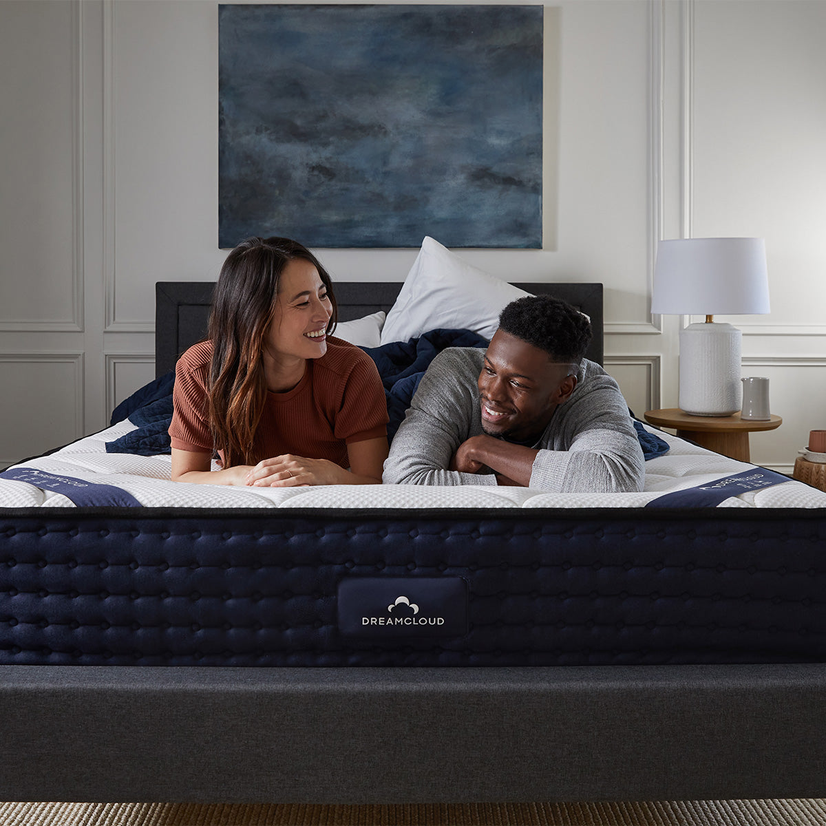 Couple Relaxing On The DreamCloud Hybrid Mattress