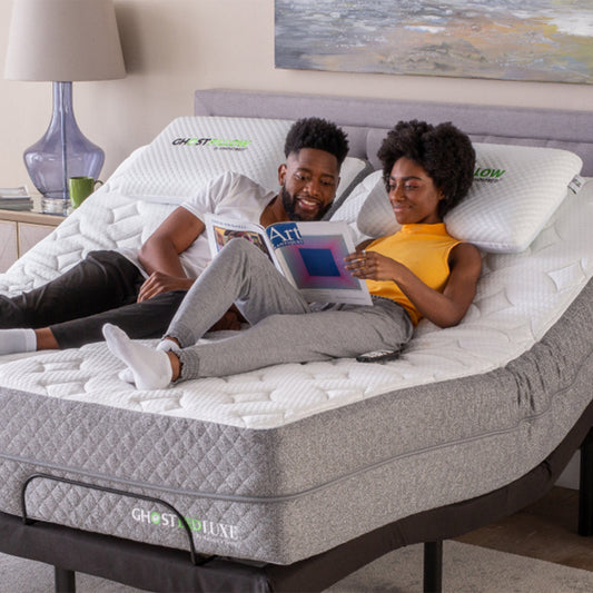 Couple relaxing on mattress on a GhostBed Adjustable Base