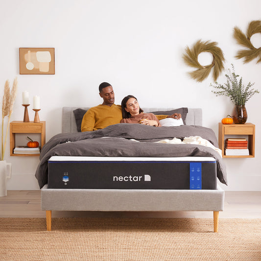 Couple Relaxing On Nectar Classic 4.0 Mattress