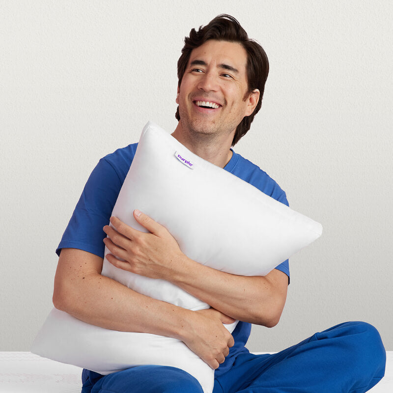 Man holding Purple Cloud Pillow 