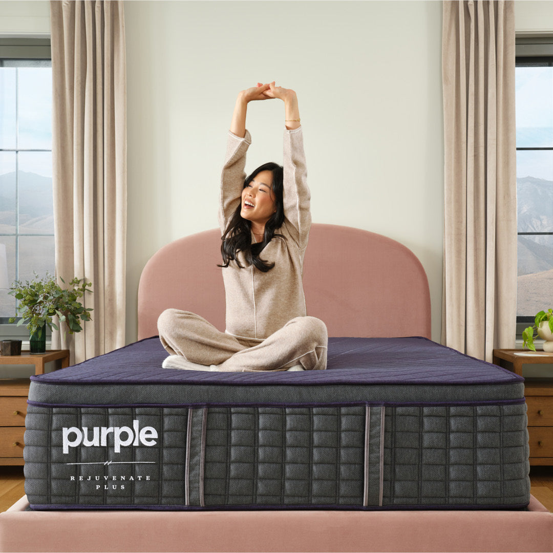 Purple Rejuvenate Plus bedroom lifestyle image with woman.