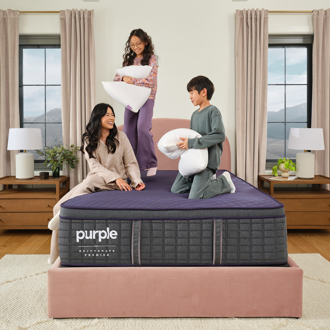Purple Rejuvenate Premier bedroom lifestyle image with family.