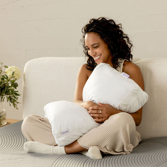 Woman holding a Purple TwinCloud Pillow