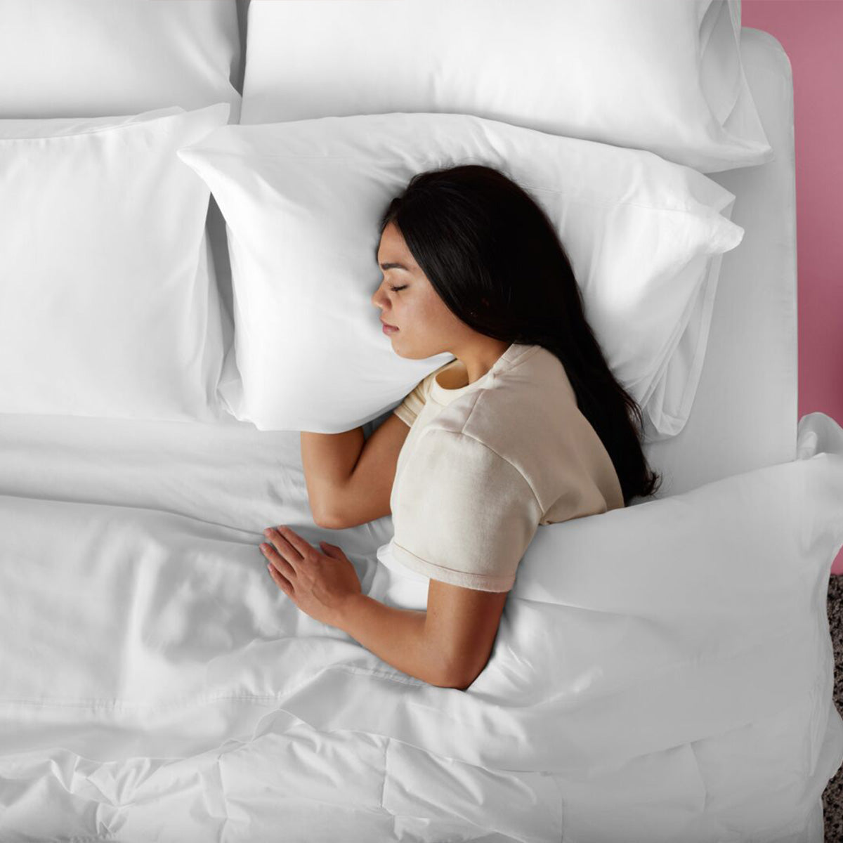 Woman Sleeping On A Purple TwinCloud Pillow In Bed