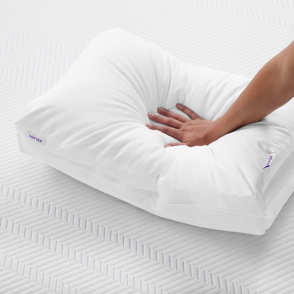 Hand Pressing Into Purple TwinCloud Pillow Softer Comfort Feel