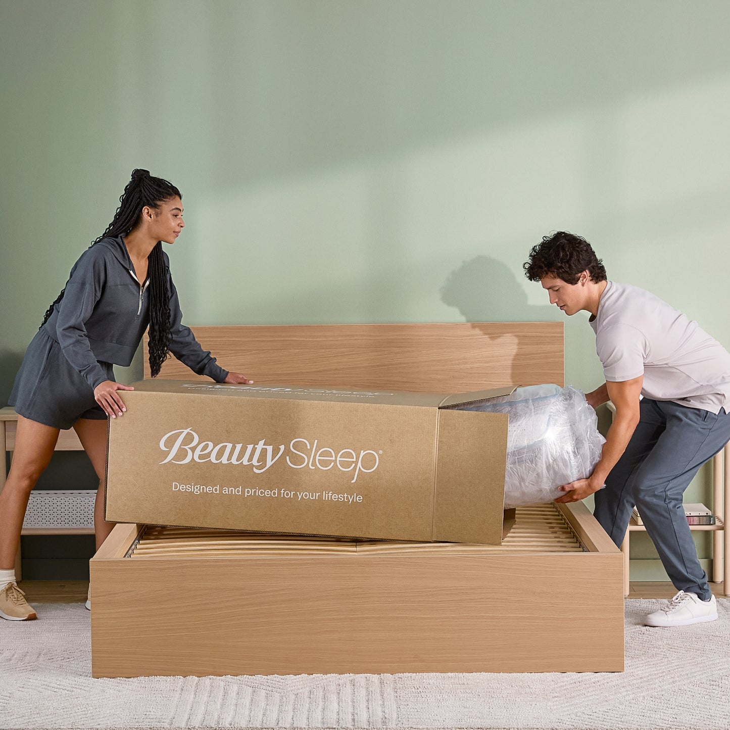 BeautySleep Simple Escape Medium Hybrid Mattress Unpacking In Room With Couple